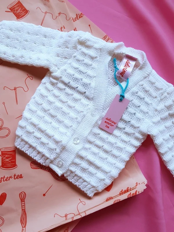 personalised_baby_cardigan_flat_lay knitted V-neck button-front woolen vests